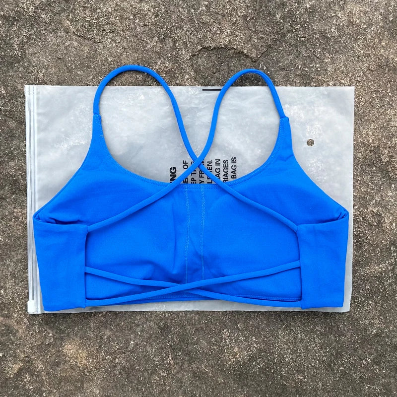 Sujetador deportivo de Color liso para mujer, chaleco de Yoga, Top deportivo para gimnasio, empuje en la espalda hueca con almohadilla para el pecho, cuatro correas cruzadas en la espalda